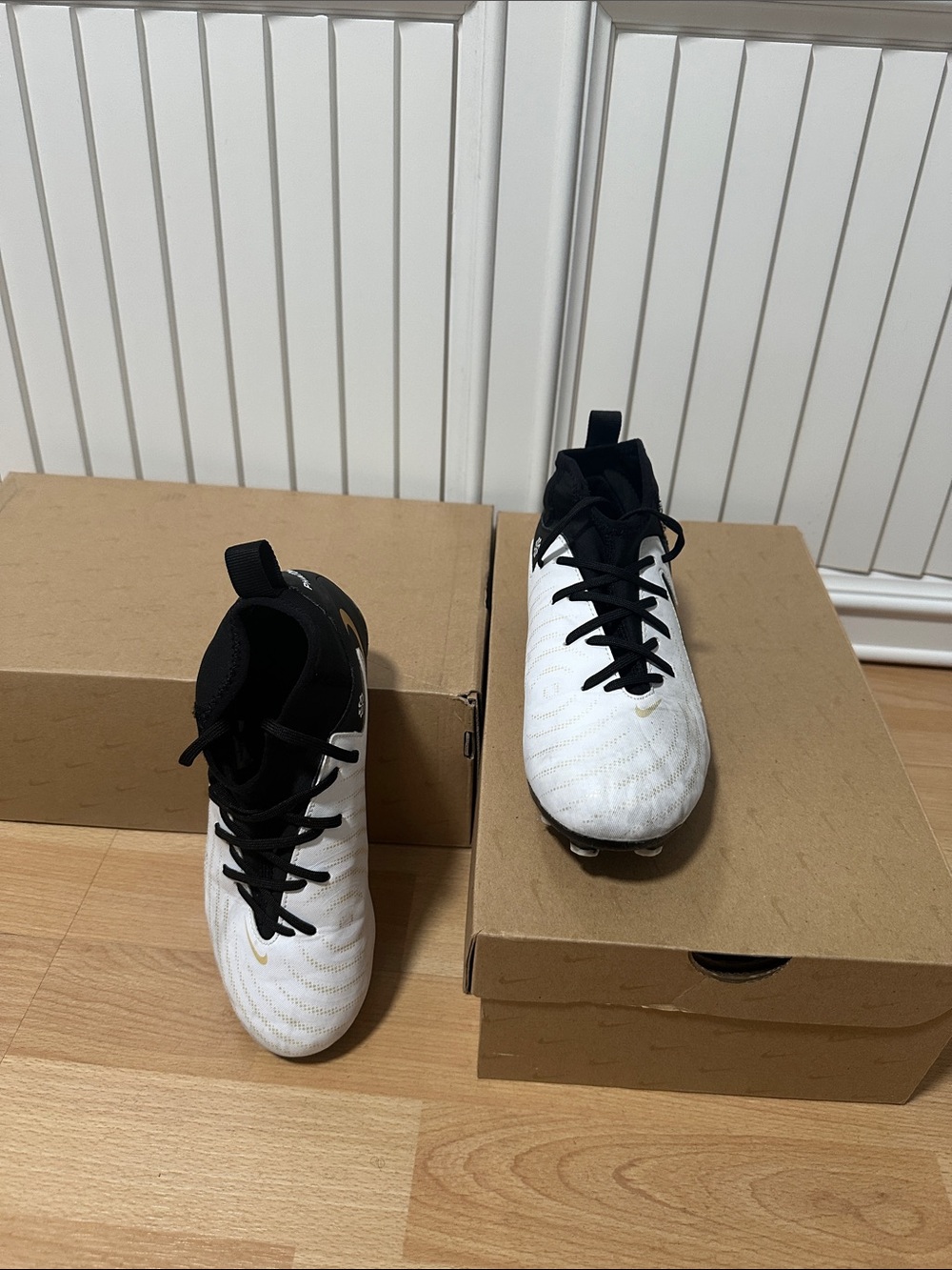 Nike Kids White and Black Soccer Cleats with Gold Accent